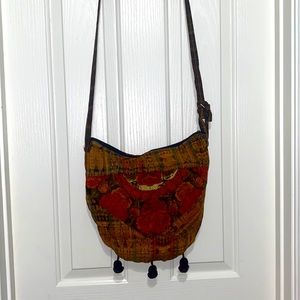 Embroidery Floral fabric crossbody  style bag with adjustable straps.